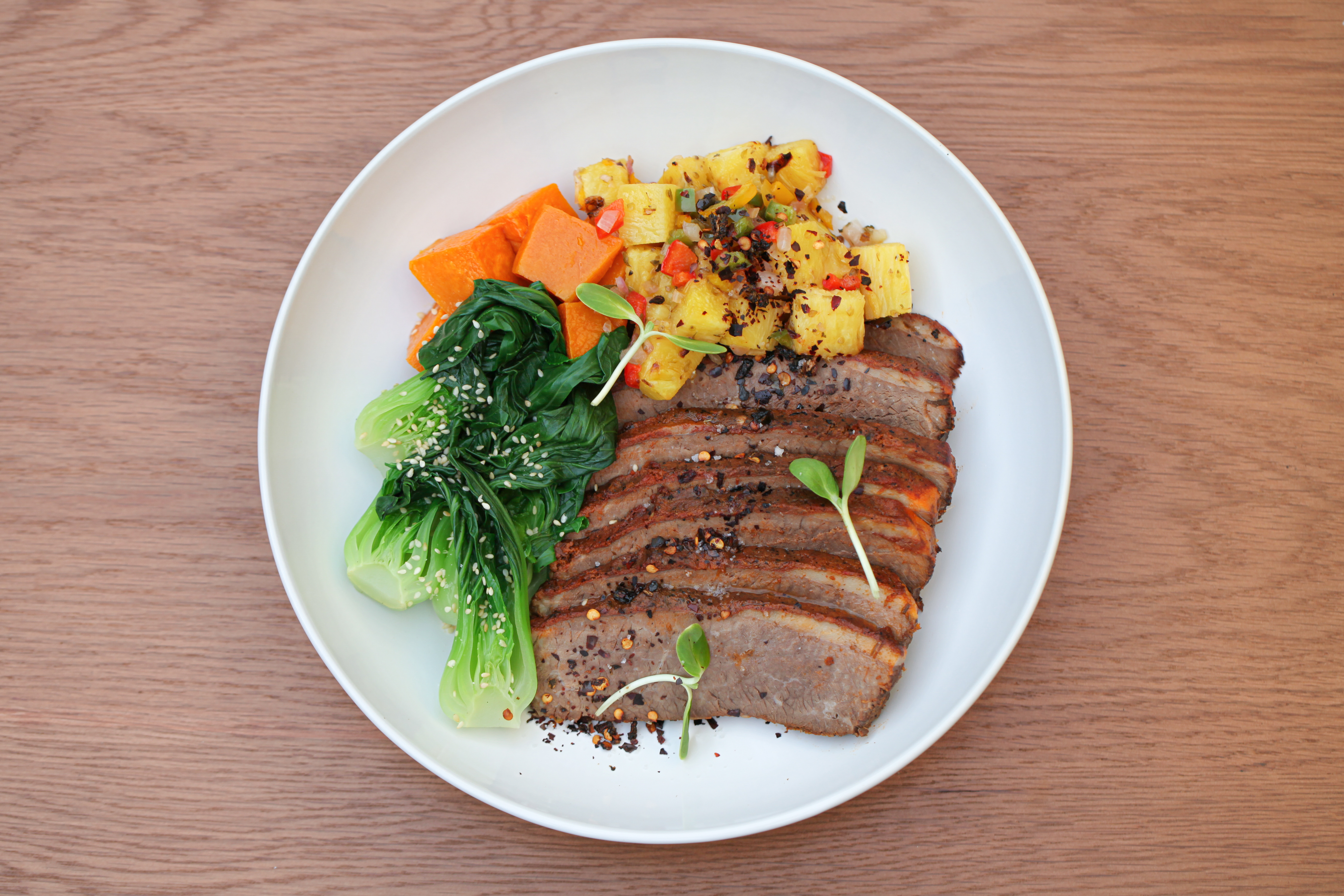 Chipotle beef brisket with roasted pineapple salsa, pumpkin, bok choy